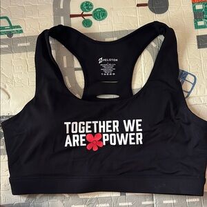 Peloton Black Sports Bra with White 'Together We Are Power' Text and Red Flower